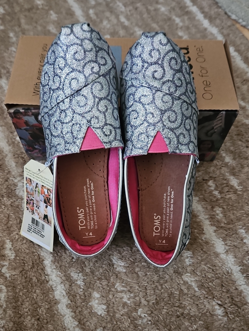 New In Box TOMS Glitter Silver Swirl Pattern with Pink Accents.